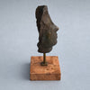 Modernist Italian bronze head on display against a neutral backdrop, emphasizing its artistic and collectible value.