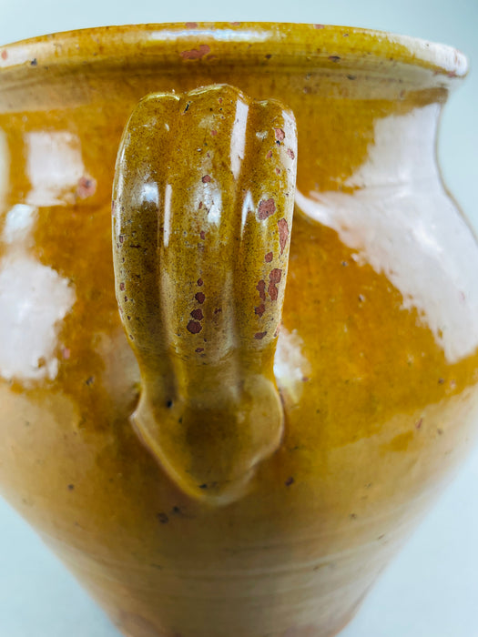 French country rustic decor featuring vintage ochre glazed pottery vessel.