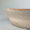 Angled image of the lebrillo bowl highlighting its large 36.5 cm diameter, deep 9 cm profile, and decorative interior surface with Moorish border patterns and a bold bird motif, suitable as a striking Mediterranean centerpiece or wall display.