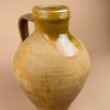 Rear angle of the rustic Spanish water jug, showing age wear, glaze drips, and hand-built texture. The natural earthen tone complements organic modern and farmhouse decor, adding authenticity to Mediterranean-inspired interiors.