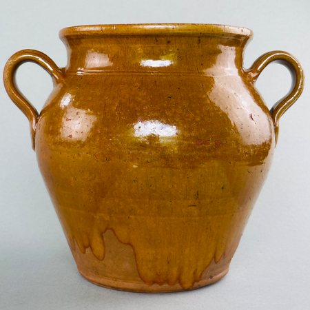Vintage Southwest French pottery jar featuring golden glaze drips, rustic surface, and charming imperfections.
