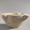 Front view of antique French marble mortar, hand-carved in the 18th century with rustic farmhouse style, measuring 30 cm wide.