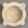 Side view of antique French marble mortar with sculpted handles and patinated stone surface, traditional apothecary tool.