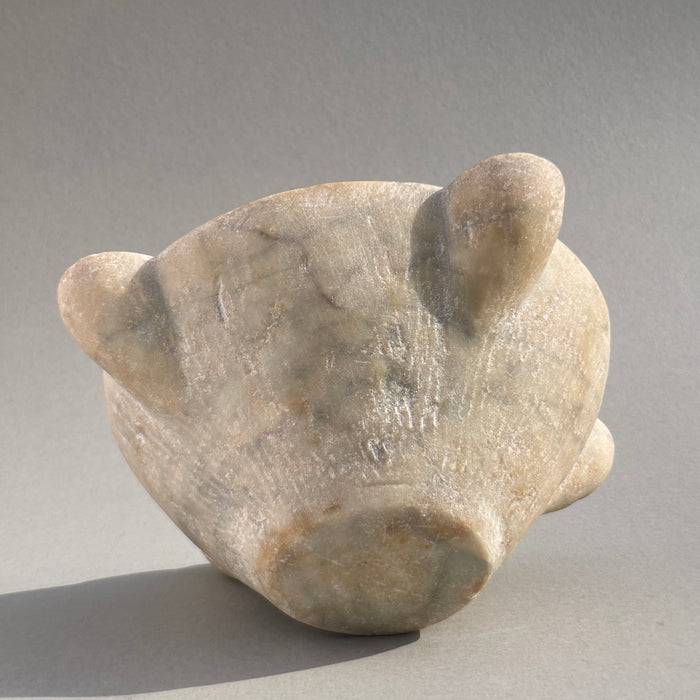 Base view of 18th-century French marble mortar, showcasing hand-chiseled details and smooth aged patina.