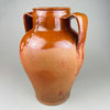 Detail of the right handle and upper body on a large decorative pot, with semi-gloss brown glaze over red clay and visible firing speckles. The handle’s squared profile emphasizes the utilitarian heritage while presenting as vintage home decor today, ideal for Mediterranean decor shelving or French provincial styling.