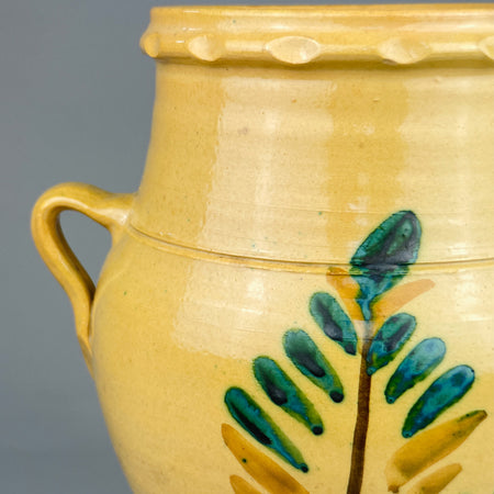 Overhead view of the Lucena orza jar showing the wide mouth, thick terracotta walls, and lobed rim. The vessel was traditionally used to store preserved foods like olives or lard and now serves as a rustic home decor object.