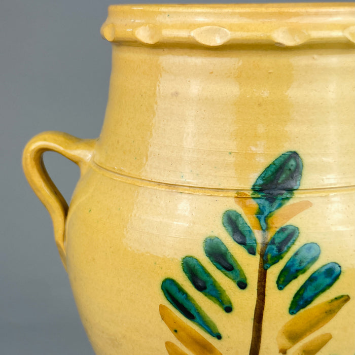 Overhead view of the Lucena orza jar showing the wide mouth, thick terracotta walls, and lobed rim. The vessel was traditionally used to store preserved foods like olives or lard and now serves as a rustic home decor object.