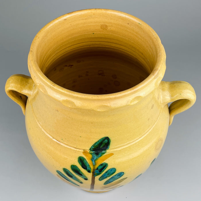 Top-down angled view revealing the jar’s internal surface and showing slight patina and marks from use. Originally functional, the piece now has strong decorative value in rustic or Mediterranean interiors.