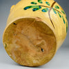 Underside of the antique orza jar showing the raw terracotta base, natural firing marks, and signs of age. This unglazed base confirms its handmade nature and use as a utilitarian vessel in early 20th-century Spain.