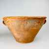 Antique Spanish terracotta vase and lebrillo bowl sourced in Cuenca, with an exceptionally uncommon deep two-handled form. Its wheel-thrown walls narrow toward a substantial circular foot, and the worn honey glaze, uneven rolled rim and softly mottled clay surface give this late 18th century pottery strong sculptural presence in farmhouse or Mediterranean decor.