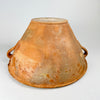 Late 18th century terracotta lebrillo showing the interior glaze as it follows the hand-thrown ridges from the broad rim toward the circular base. The amber surface varies from glossy to worn and matte, with small pits and age marks that contribute to the authentic patina of this Spanish folk pottery vessel for rustic and wabi sabi decor.