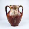 Wide mouth and interior of a traditional Spanish orza storage jar, with a dark brown glazed cavity, circular throwing rings and a naturally irregular rim. The nineteenth century terracotta vessel was made for domestic storage and now works as an antique pottery vase for dried branches, Mediterranean decor or wabi sabi decor.