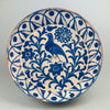 Antique Spanish Fajalauza lebrillo bowl from the late 19th century, hand-painted with a cobalt bird surrounded by Moorish floral scrolls and borders, showcasing Andalusian ceramic artistry in blue over white tin-glaze on terracotta.