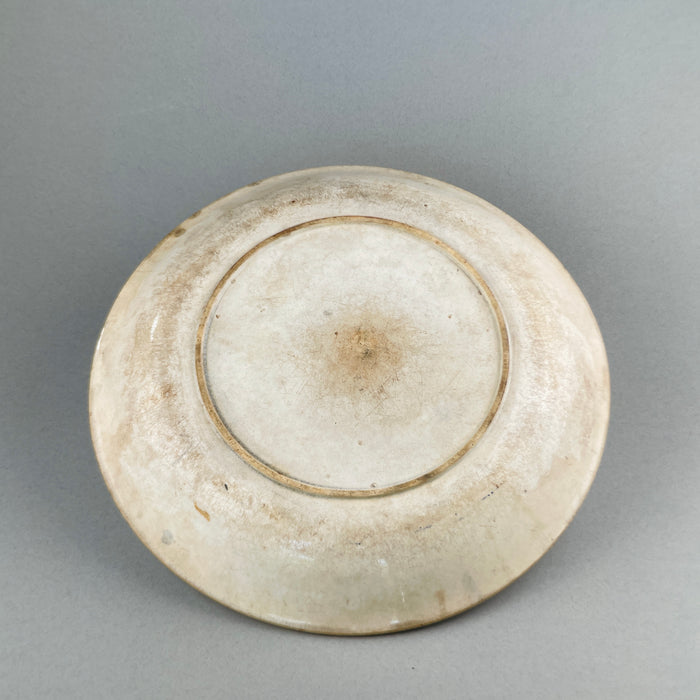 Back detail of English ceramic platter showing worn Victorian glaze and classic foot ring.