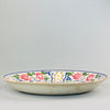 Large English wall or table platter from the Arts and Crafts movement, featuring bold symmetrical design.