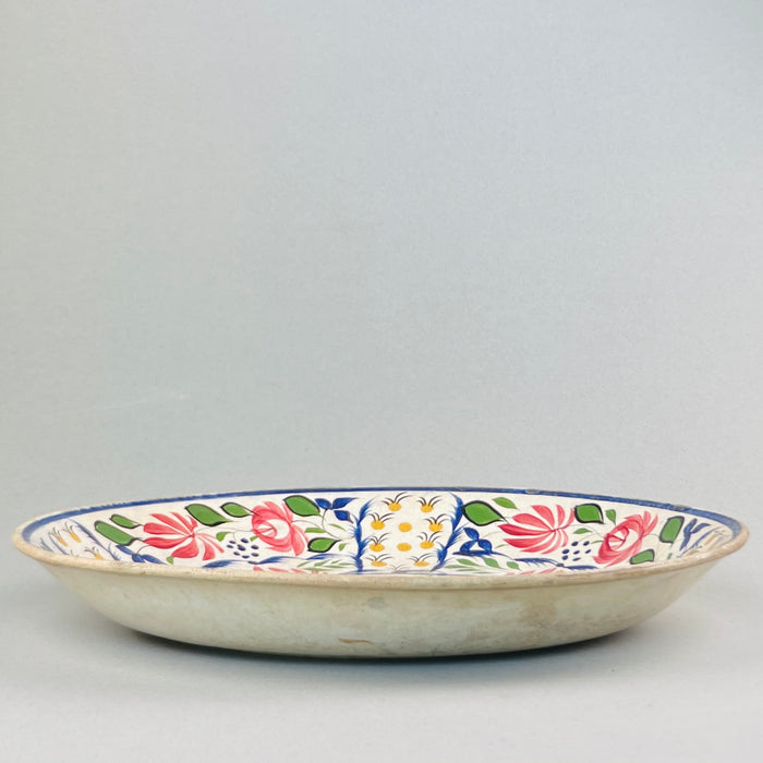 Large English wall or table platter from the Arts and Crafts movement, featuring bold symmetrical design.