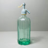 Decorative vintage soda siphon from Spain, combining nostalgic charm and industrial barware functionality, ideal for display or collection. Elegant side profile of the siphon showing off the tall cylindrical form, etched markings, and stylish European proportions.