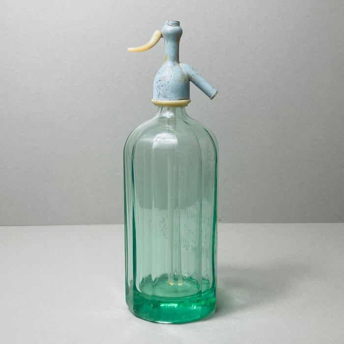 Decorative vintage soda siphon from Spain, combining nostalgic charm and industrial barware functionality, ideal for display or collection. Elegant side profile of the siphon showing off the tall cylindrical form, etched markings, and stylish European proportions.