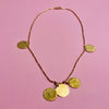 Aurelia Collection gold-tone necklace with hammered coin pendants on a fine link chain. Nickel free with spring-ring clasp, this 47.5 cm necklace reflects Mediterranean-inspired jewelry traditions with modern artisan detail. Lightweight at 7 g for versatile wear.