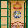 Antique Manises pottery charger with a stylized golden yellow bird at the center of a creamy white tin glazed surface. A dense radial border alternates cobalt blue fields, three pink floral panels and three green rosettes outlined in brown, making this Spanish ceramic plate striking wall art or a table centerpiece