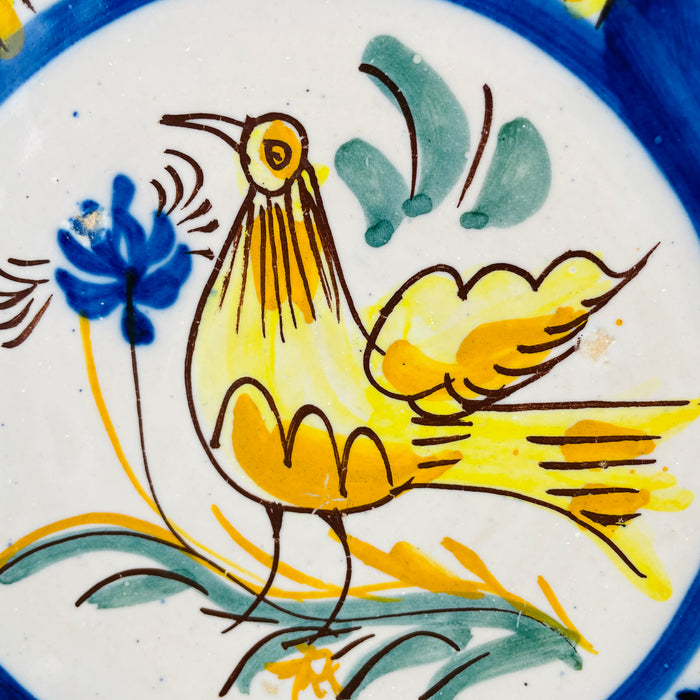 antique Spanish ceramic charger showing its 5 cm depth, thick rolled rim and substantial shallow bowl silhouette. The glazed earthenware body gives the plate more sculptural wall presence than a flat dish and also allows display on a stand as Mediterranean decor or Spanish pottery centerpiece.