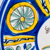 Antique large Manises bird charger in tin glazed earthenware, hand painted around circa 1900 with a golden yellow bird, cobalt blue radial border, pink flowers, green foliage and geometric rosettes. This Spanish majolica wall plate combines folk pottery character with the scale and color needed for a Mediterranean decor centerpiece.