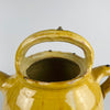 Top-down view of the terracotta gargolette pot, showing the opening and glaze depth. The handmade irregularities confirm its 19th century southern French origin. A strong fit for farmhouse decor, Mediterranean decor, and rustic home decor, adding visual warmth and artisan appeal to shelves or tabletops.