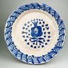 Antique Spanish Fajalauza bowl, hand-painted with pomegranate motif in cobalt blue, shown from overhead view to highlight intricate tin-glazed interior and rustic patina.