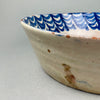 Handcrafted terracotta ceramic bowl from Granada, late 1800s, decorated in deep blue glaze with symbolic regional fruit imagery.
