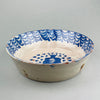 Rustic Spanish pottery with tin-glazed finish and cobalt accents, viewed in full to showcase functional form and decorative appeal. Wabi-sabi styled pottery with distressed glaze and visible brushwork, photographed as a sculptural rustic design object.
