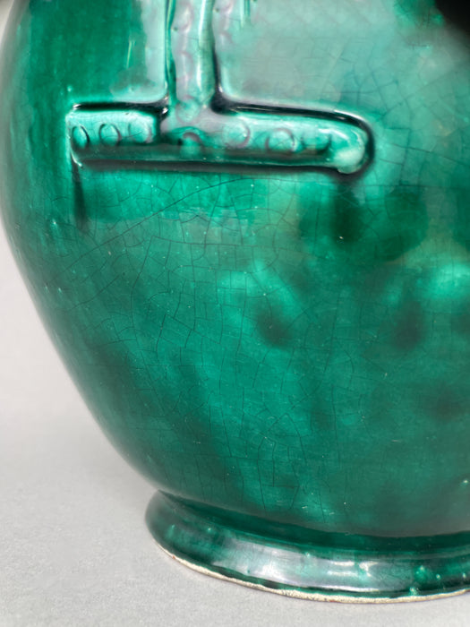 Angled overhead shot of vintage French terracotta gargoulette, showing the wide body, sculptural form, and intentional glaze drips that give this piece artisanal character and visual interest.