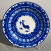 Antique Spanish Manises plate, hand-painted ceramic with blue and white bird motif, photographed from the front to show full decorative design and symmetry typical of 19th-century Valencian pottery.