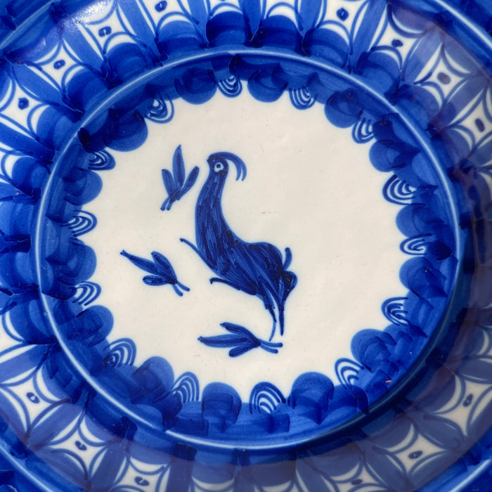 Vintage Manises pottery detail view with a stylized bird and surrounding brushstrokes, ideal for rustic Mediterranean or eclectic wall decor settings.