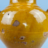 Full product image of antique glazed French jug with classic form and ochre glaze, presented against a neutral background to emphasize silhouette and color, perfect for online catalog use or vintage ceramic product listings.