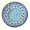 Large ceramic wall bowl inspired by Fajalauza pottery from Granada, Spain, with a pierced hanging hole on the reverse for vertical display. The hand painted blue and green design combines lattice geometry, vegetal motifs, and a deep bowl profile, making it suitable for Spanish ceramic decor and Mediterranean wall art.