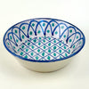 Large ceramic wall bowl inspired by Fajalauza pottery from Granada, Spain, with a pierced hanging hole on the reverse for vertical display. The hand painted blue and green design combines lattice geometry, vegetal motifs, and a deep bowl profile, making it suitable for Spanish ceramic decor and Mediterranean wall art.