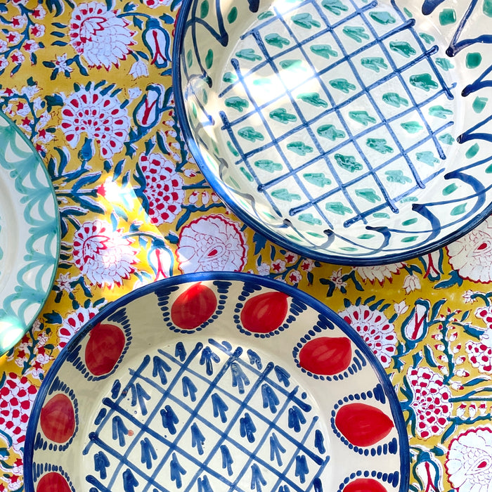 Spanish Fajalauza bowl with green and blue hand painted decoration, made as a deep Granada pottery platter with a wide rounded form and glossy glazed surface. The design includes cobalt lattice lines, abstract green vegetal marks, and a blue rim, suitable as ceramic wall bowl decor, tabletop display, or decorative fruit bowl.