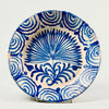 Antique Spanish Fajalauza lebrillo bowl from Granada featuring a cobalt hand-painted palm tree in the center and rhythmic wave motifs around the rim, photographed from the front to showcase its full decorative surface and historic Andalusian ceramic design.
