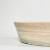 Profile view of the 9 cm tall Fajalauza bowl highlighting the flared form, subtly warped rim, and natural irregularities of its wheel-thrown structure, emblematic of handcrafted 19th-century Andalusian ceramic practices.