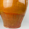 XL Spanish terracotta storage jar, two handle earthenware vessel with a thick rolled rim and clear wheel-thrown rings around the neck. The honey amber glaze is glossy and even in tone, with localized pooling at the shoulder and a pronounced glaze break, suited to Mediterranean decor and rustic home decor.