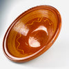 This large antique French terracotta bowl combines a wide open tian form with a warm glazed interior, delicate yellow line decoration, and a pale unglazed body. The balanced proportions and rustic surface make the early 20th century Southern French pottery suitable as a fruit bowl, table centerpiece, or sculptural accent within farmhouse decor.