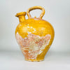 Large antique Wabi Sabi French yellow pot dating to the early 19th century, hand thrown in terracotta in Provence and covered with mustard glaze. The sculptural 38 cm cruche has a rounded ovoid body, high overhead handle and extremely rare broad pinched spout, creating a distinctive gargoulette water-jug silhouette for French country decor.