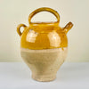 Side angle capturing ochre glaze and spout profile of antique French water pitcher, emphasizing craftsmanship and texture. Integrates perfectly into farmhouse dining decor and Japandi-inspired rustic interiors.