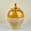 Close-up detailing and spout of antique yellow-glazed pottery jug. A fine example of Figeac pottery, historically used for cooling water or wine, now perfect for farmhouse table decor and cottage-style interiors.
