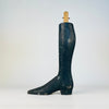 Single wooden lower leg from a nineteenth century French tailor’s mannequin, carved with an elongated boot, low shaped heel and refined taper from calf to ankle. The black paint has developed extensive rubbing, losses and marks, and the ankle join remains clearly visible. A distinctive collectible for oddities decor and fashion history collections.