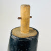 Construction detail on an antique French wooden mannequin leg reveals the pronounced open separation where the carved boot joins the ankle and heel. Small round holes, scratches, rubbed black paint and exposed pale timber are clearly present. These authentic signs of age give the nineteenth century fragment particular appeal for oddities decor.