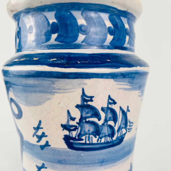 Hand painted Spanish faience pharmacy jar with cobalt blue brushwork over a white tin glazed ground, featuring cartouches, border bands, and readable herb labels. These albarello style jars are consistent with historic Spanish botamen traditions and are often collected for antique ceramics displays. Styling ideas include pairing with woven baskets, terracotta, and aged wood for farmhouse decor, or with clean neutrals for japandi decor.
