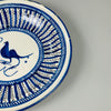 Side profile of antique Manises ceramic plate, showing shallow bowl shape, 3.4 cm in height, hand-painted in radial cobalt blue and ideal for hanging in vintage rustic kitchen or gallery wall.