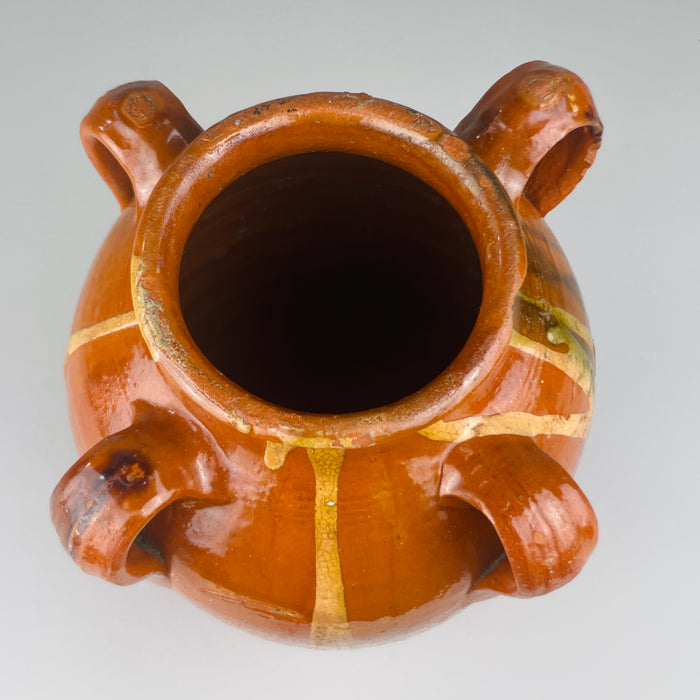 Jar viewed from above, showing narrowed neck and symmetrical looped handles, ideal for Mediterranean kitchen styling or antique pottery displays in rustic homes, ceramic shops, or collector presentations.