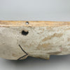 Mask displayed at a slight angle to highlight cheek detail, mouth line, and incised patterning, showcasing craftsmanship typical of African ceremonial art adapted for decorative wall presentation.